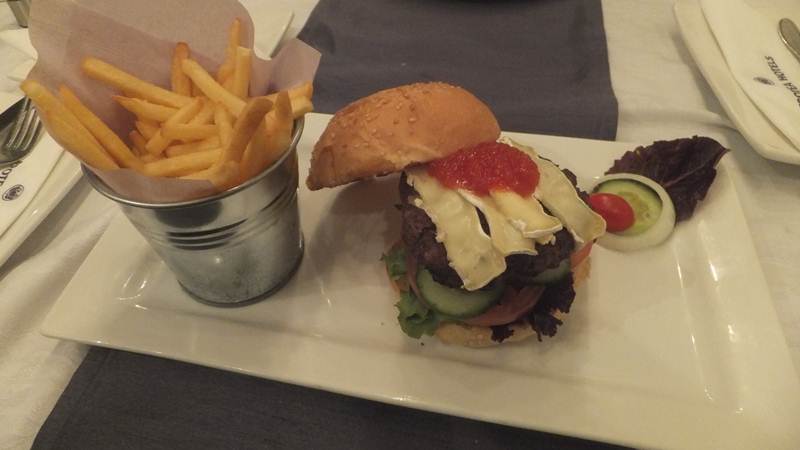 beef burger topped with Pepperdew jam and Camembert