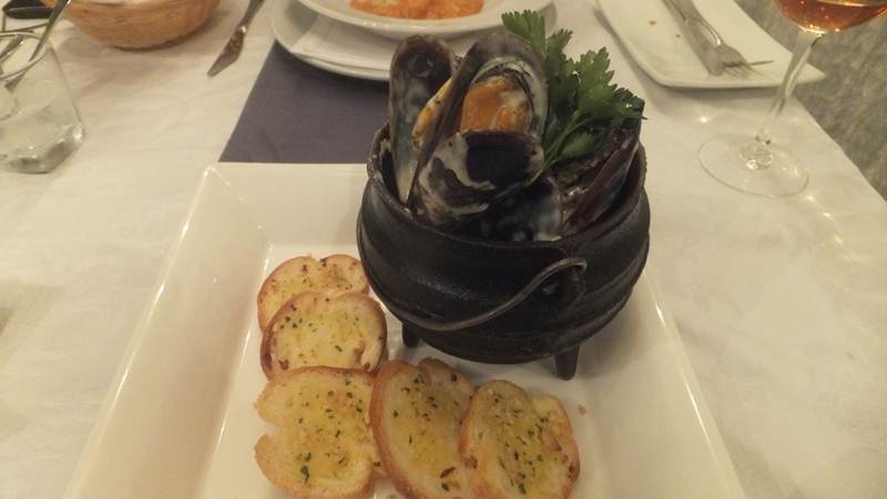 fresh local mussels in a creamy, white wine sauce