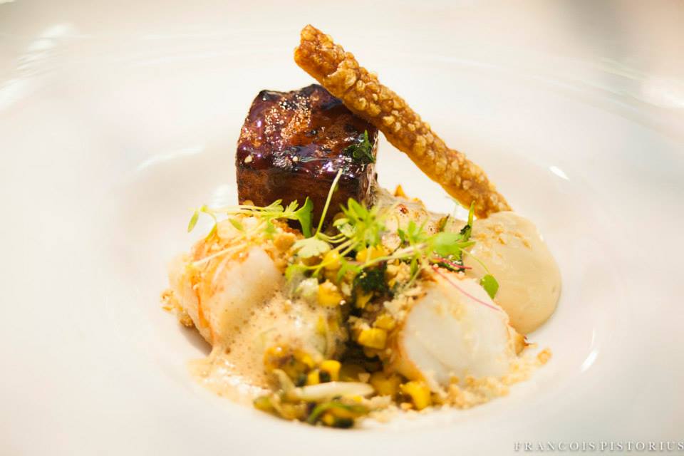 Poached crayfish, asian glazed pork belly, pan roasted corn, seared cucumber, crayfish bisque and braised cauliflower puree